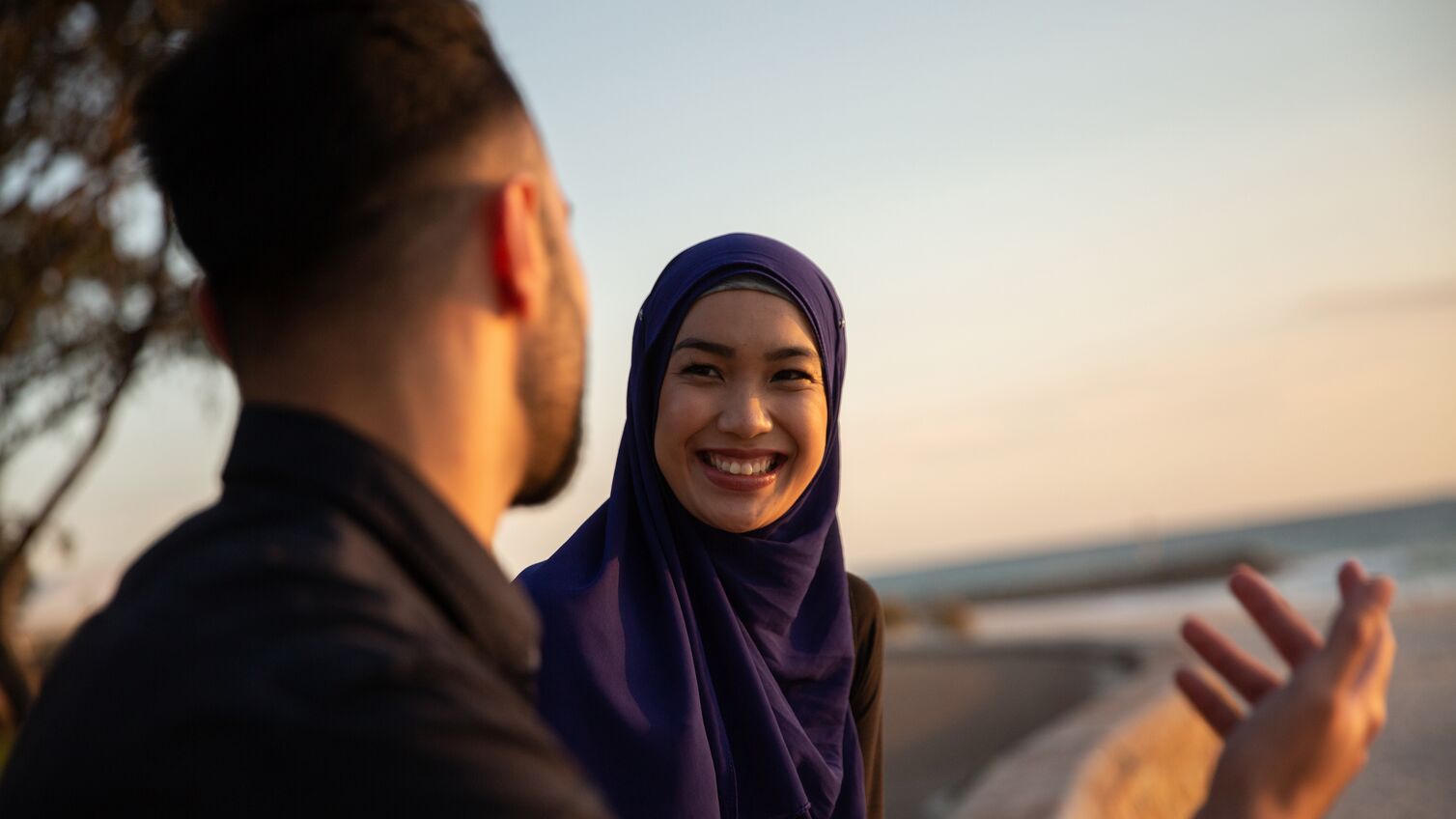 Friends at a beach chatting