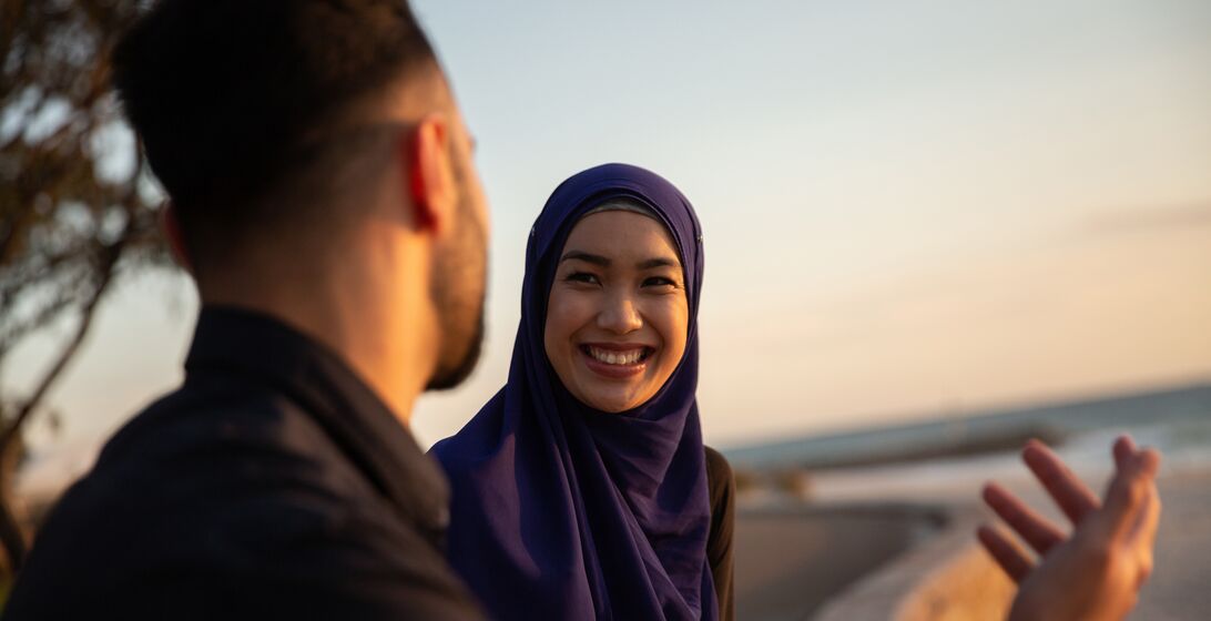 Friends at a beach chatting