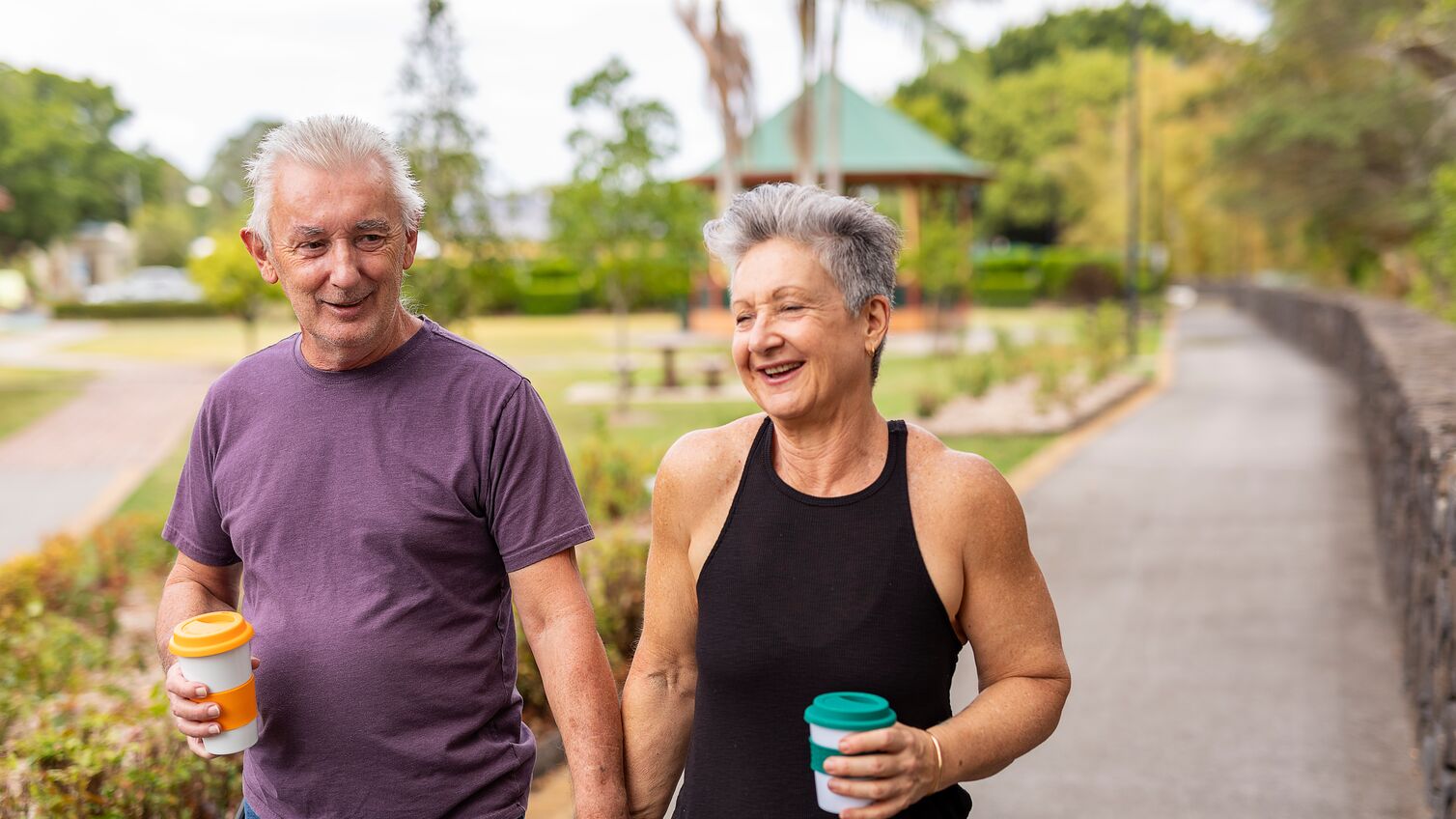 Senior Couple Walking Together in a Public Park