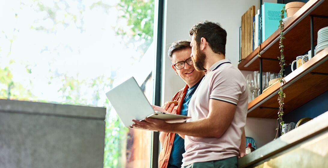 Entrepreneurs teleworking from kitchen, running small business, using laptop, connection, wireless technology