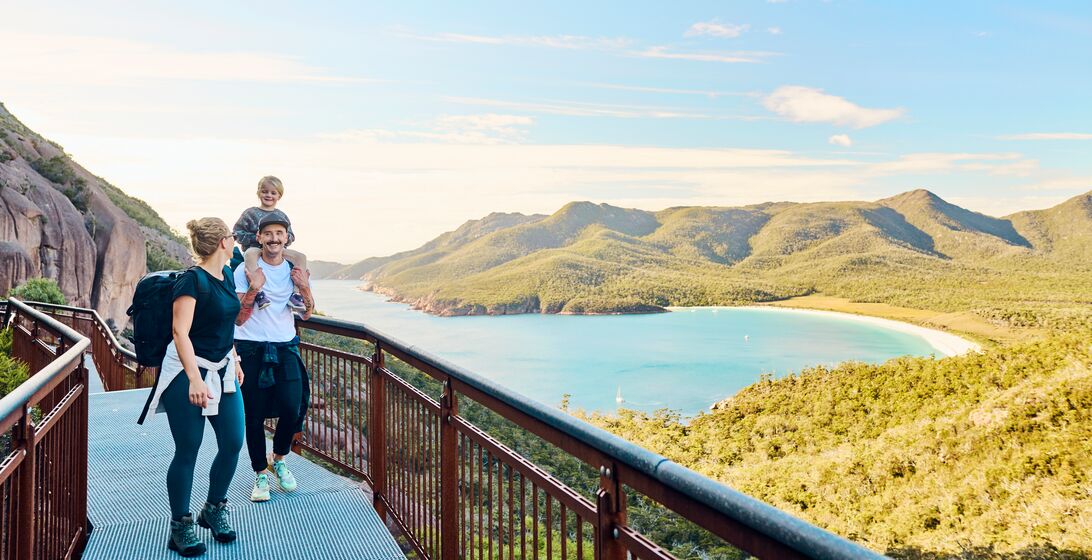 Young active family with a toddler bushwalking outside in the beautiful Freycinet National Park.