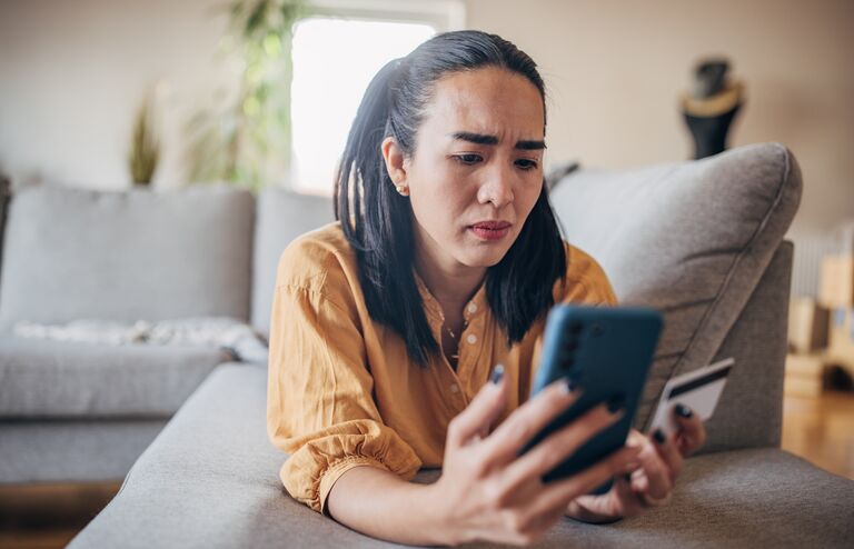 Woman experiencing scam online on the credit card