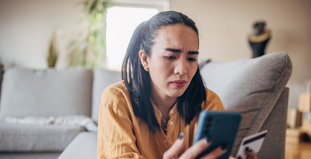 Woman experiencing scam online on the credit card