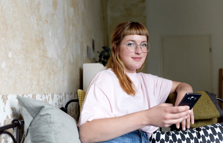 Female student using smartphone