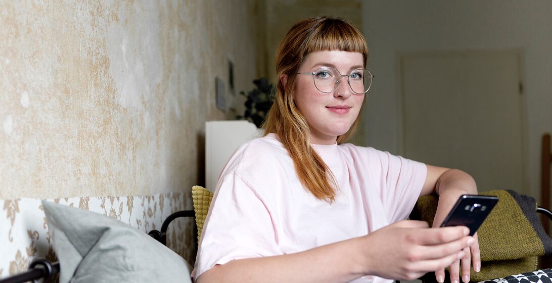 Female student using smartphone