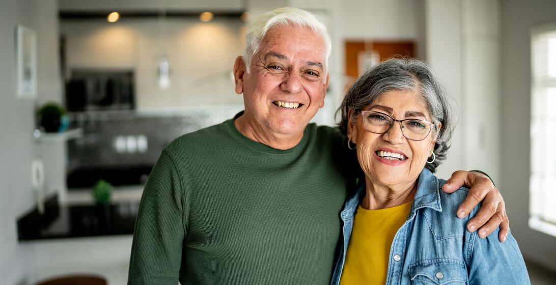 Portrait of a senior couple embracing at home