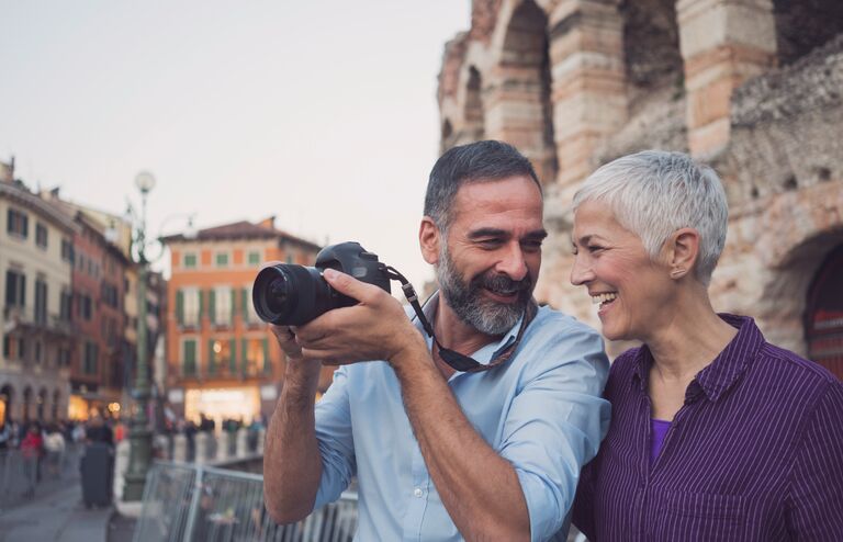 Mature couple as tourist in city Verona