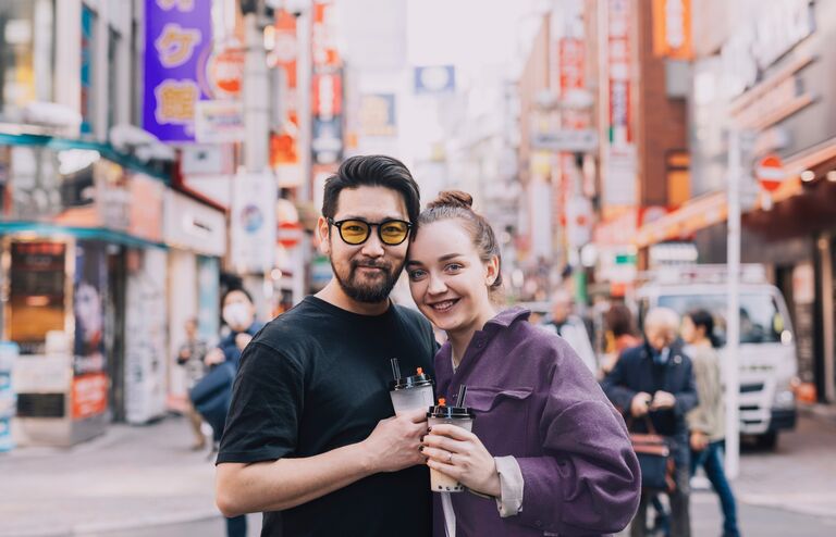 Travelers enjoying a bubble tea in Tokyo