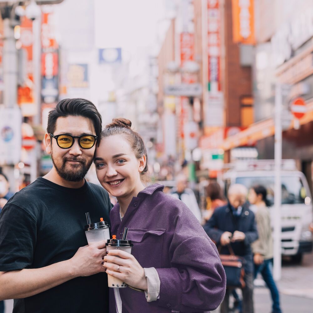 Travelers enjoying a bubble tea in Tokyo