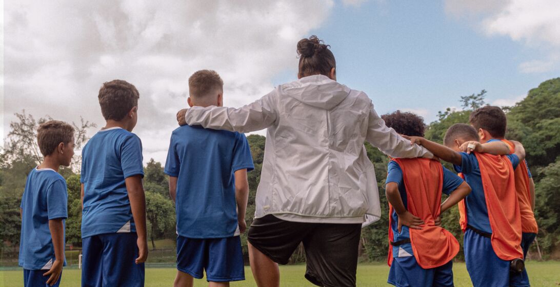 Header image of a group of people in the community participating in group activities