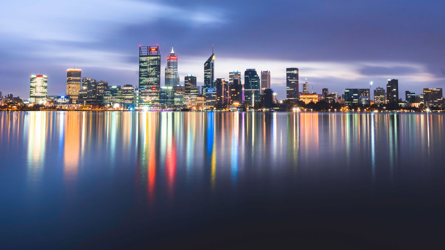 The Perth skyline in Western Australia with the lights reflected in the lake, long exposure