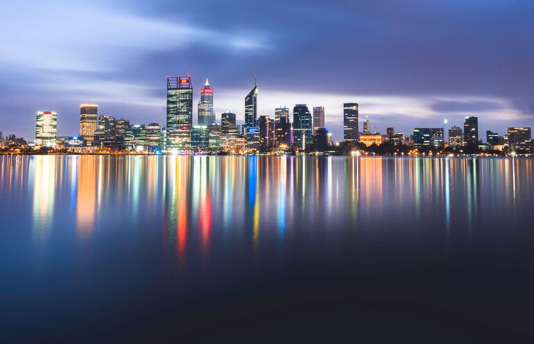 The Perth skyline in Western Australia with the lights reflected in the lake, long exposure
