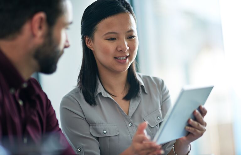 Cropped shot of two businesspeople sitting in a meeting