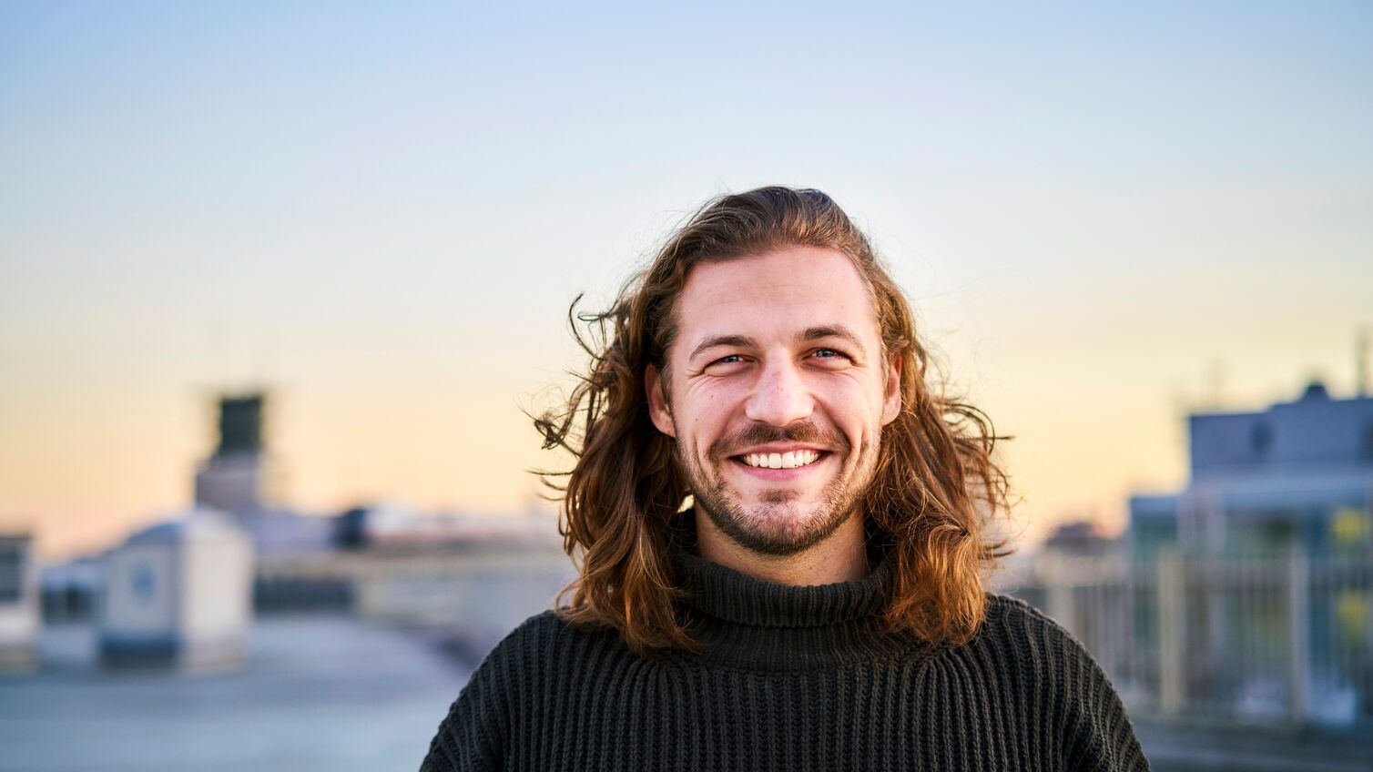 Portrait of bearded young man smiling
