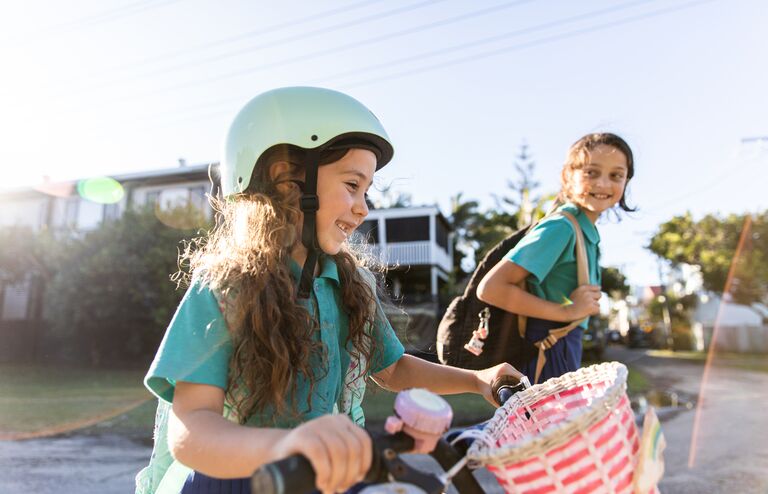 Real life Aussie sisters walk and ride home from school together