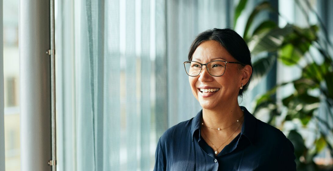 Woman wearing glasses and a blue button up shirt