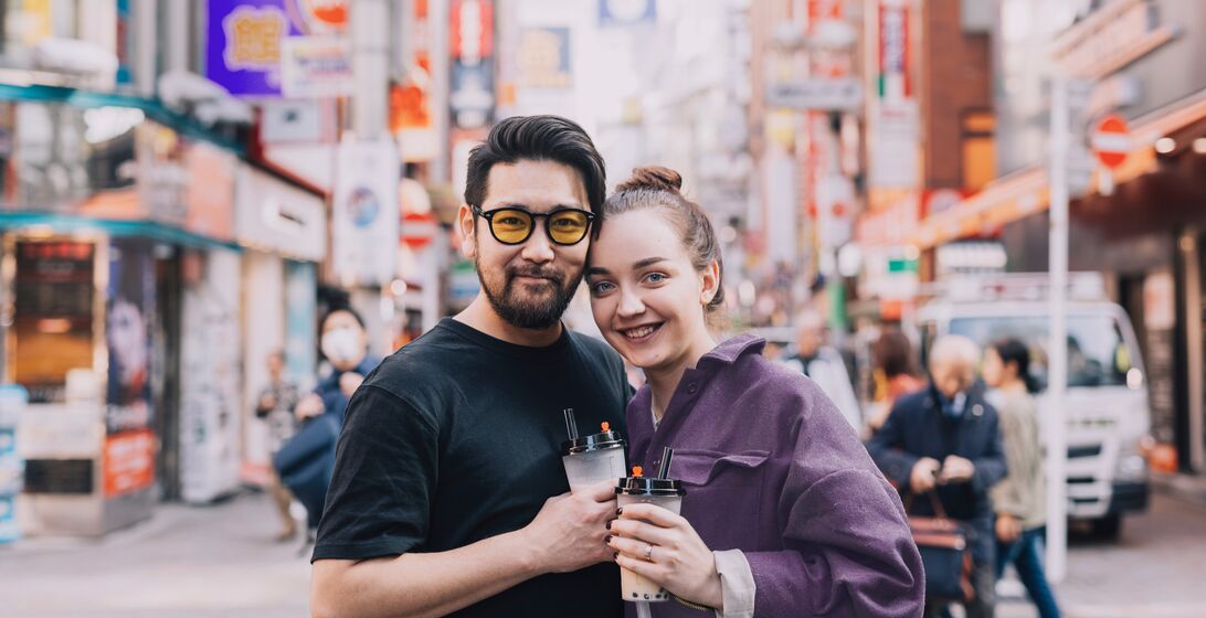 Travelers enjoying a bubble tea in Tokyo