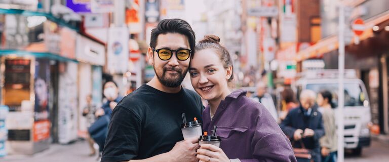 Travelers enjoying a bubble tea in Tokyo
