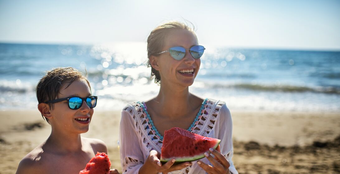 Brother and sister eating watermelon on the beach...Nikon D850