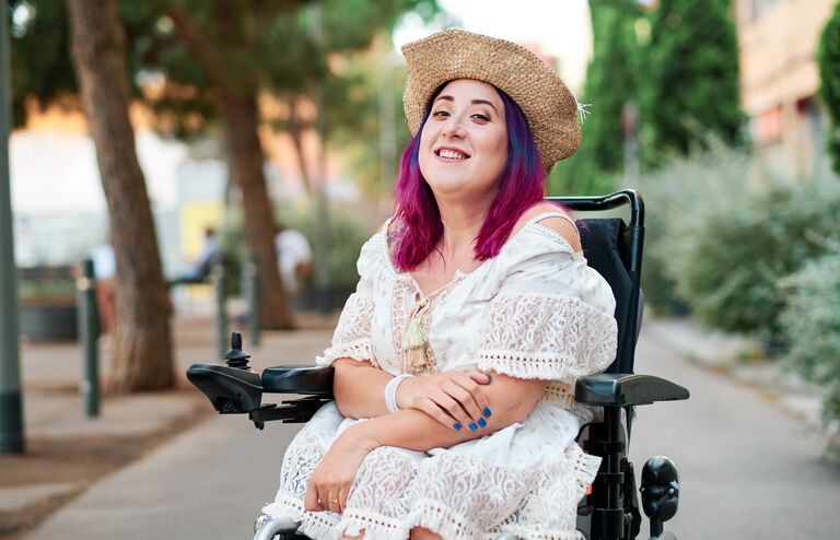 portrait of adult woman with disabiliites looking at camera
