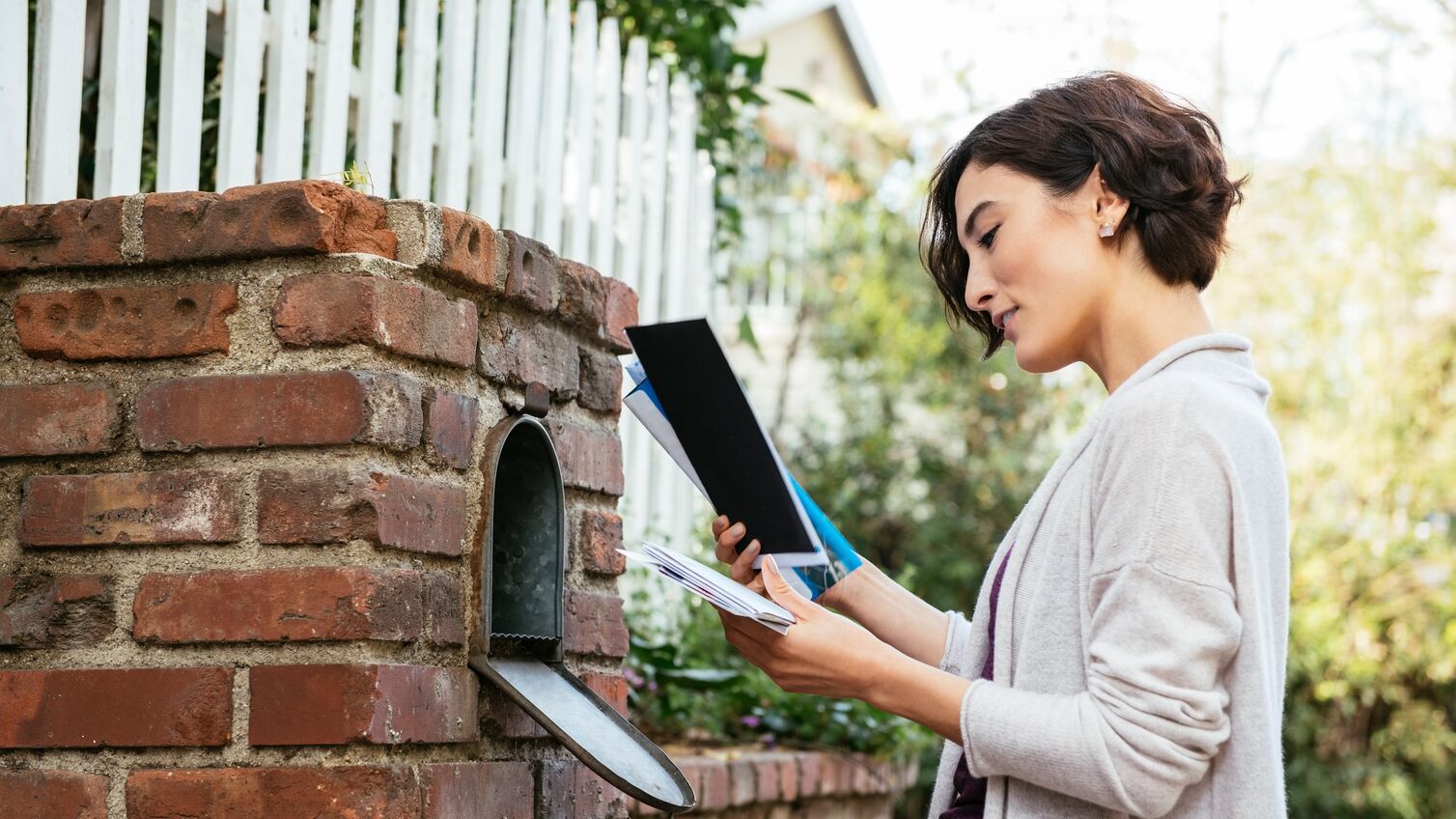 Lady checking her mail.