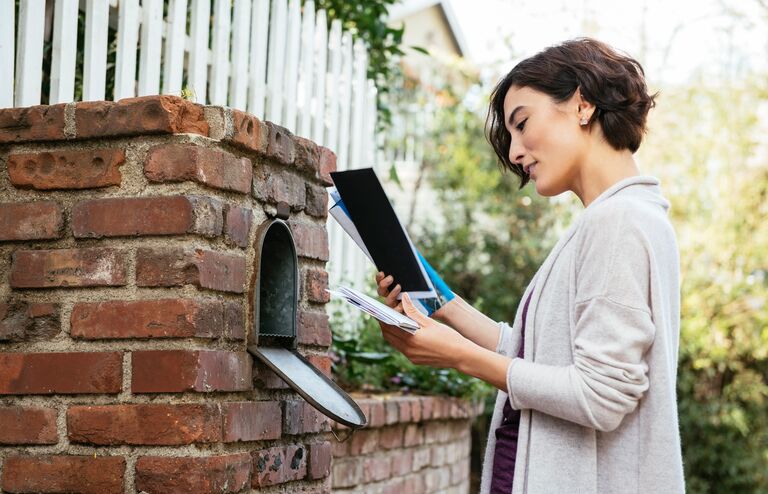 Lady checking her mail.