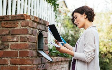 Lady checking her mail.