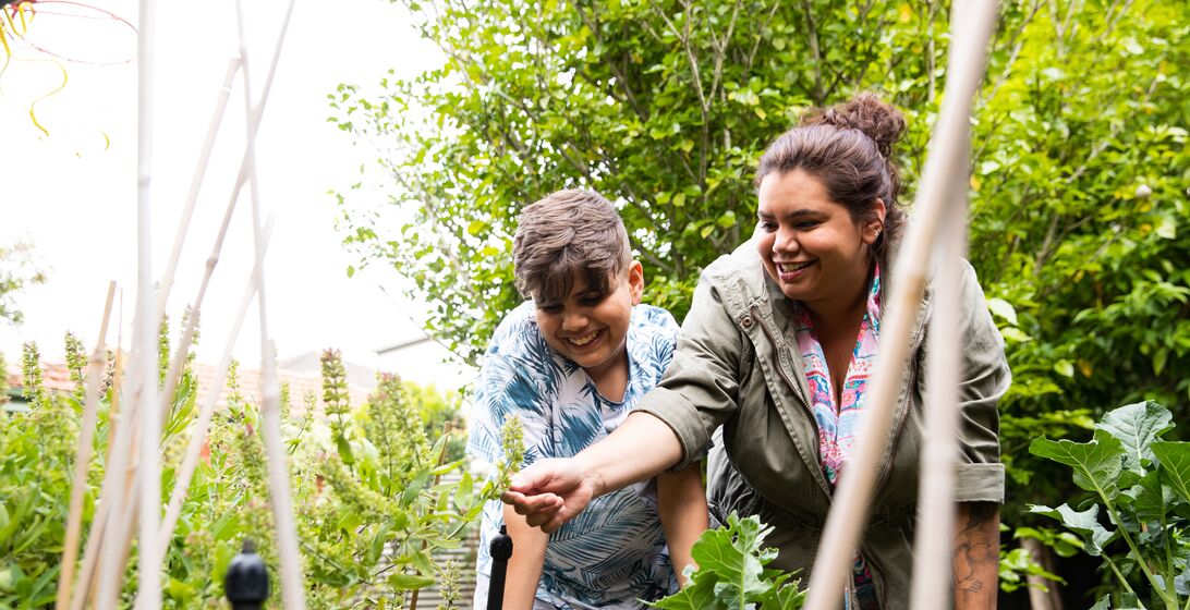 Indigenous Australian family with 2 children living a sustainable suburban Australian lifestyle.