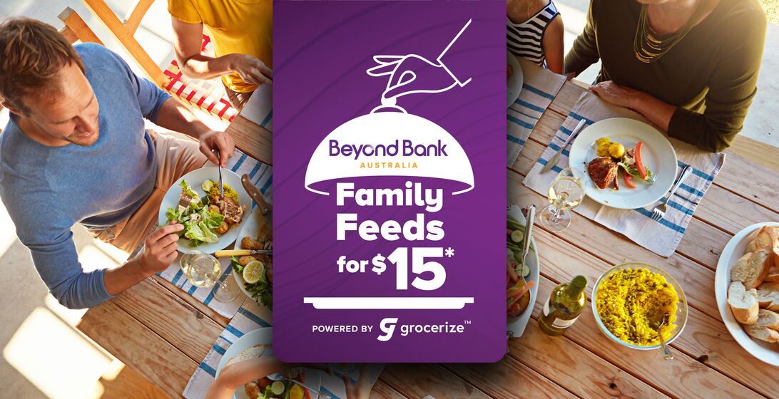 Family eating dinner at a table with a text overlay that reads "Family Feeds for $15*"