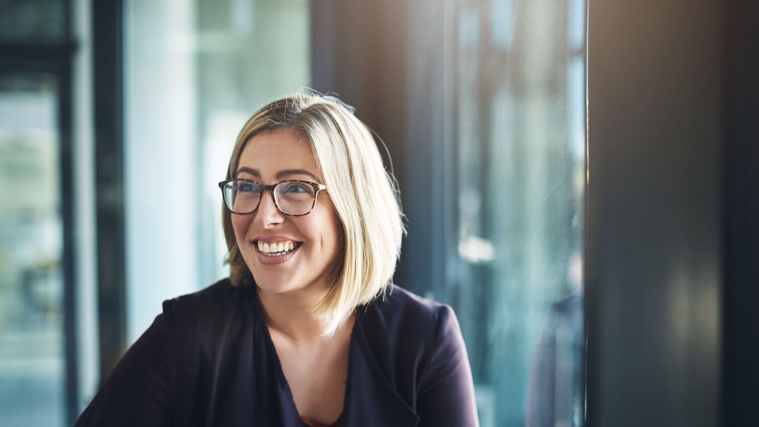Shot of a happy businesswoman in a modern office